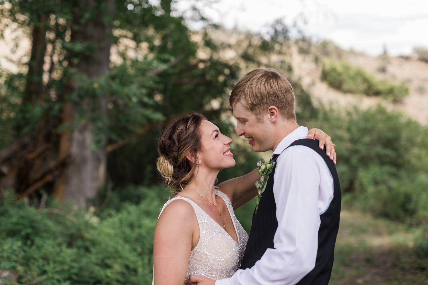 A bride and groom gaze lovingly at each other before their wedding in Winthrop, Eastern Washington. | Joanna Monger Photography | Seattle & Snohomish Wedding Photographer