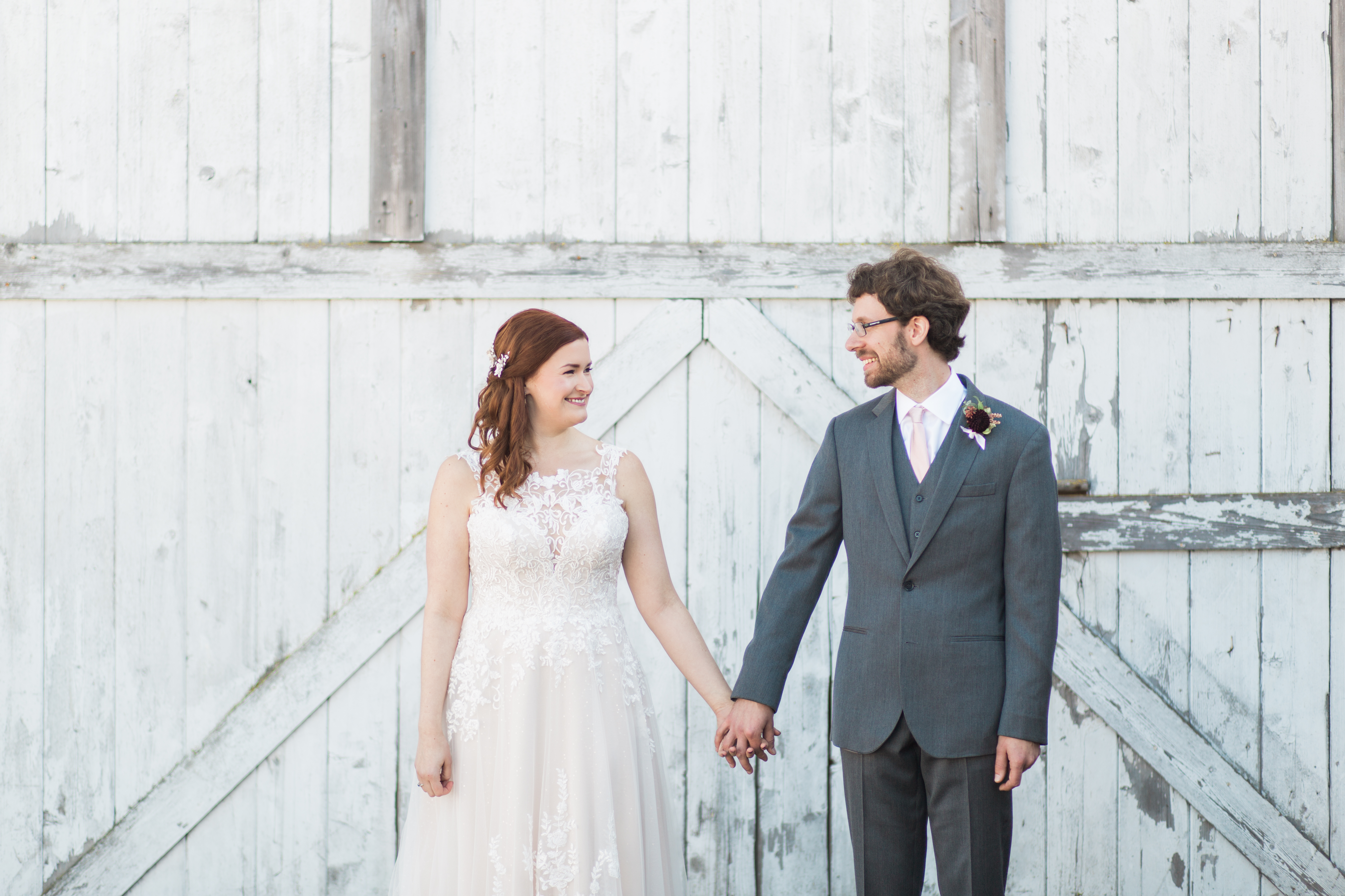 Kate and Jon's dreamy, DIY fall Dairyland wedding in Snohomish, featuring a white-washed barn, vintage touches, and lush burgundy and rose floral. | Joanna Monger Photography
